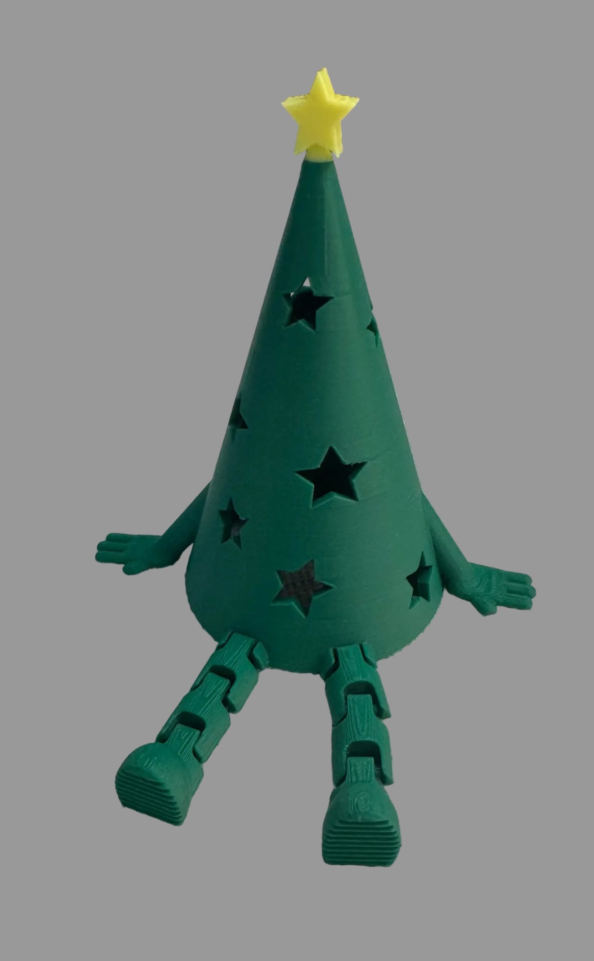 3D printed hollow tree with star on top. Add a tea light underneath to light up this adorable tree with articulated legs. 